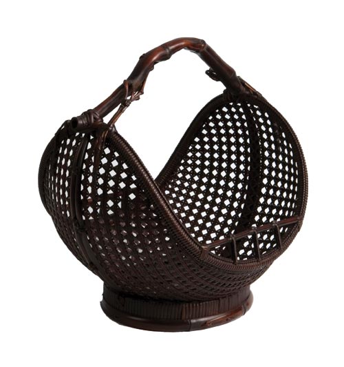 The crescent-shape Eight-Day Moon Flower Basket was created and signed by Maeda Chikubosai I (1872-1950), one of the most important bamboo artists of the early 20th century. Note the beautiful patina and the section of naturally curved bamboo with small branches incorporated into the woven basket as a handle.Courtesy Erik Thomsen Asian Art, New York, N.Y. 