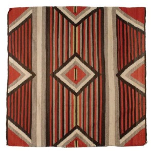A central diamond surrounded by eight triangular elements at the edges creates a distinctive image that has made the Third Phase blankets the best-known Navajo weavings. This chief blanket (58¼ inches square) is woven of native handspun wool colored with natural and aniline dyes. It sold for $1,955. Cowan’s Auctions Inc.