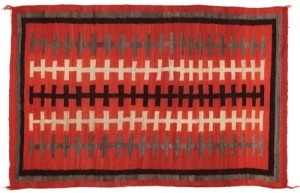 Western Reservation refers to the remote western region of the Navajo Nation in northern Arizona. “Railroad tracks” on a vibrant red ground run the length of this Western Reservation weaving (80 by 52½ inches). It sold within estimate for $2,300. Cowan’s Auctions Inc.
