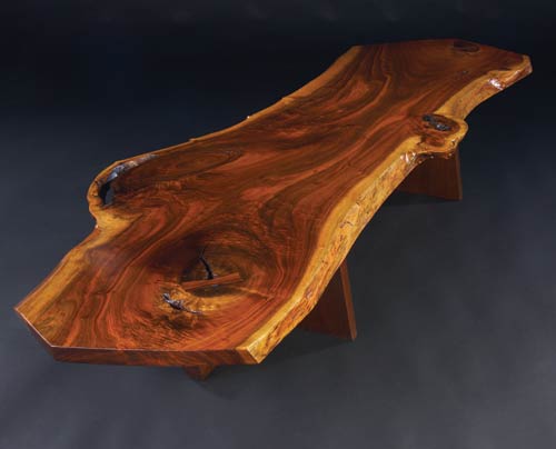 The free-form, free-edge walnut top incorporating two rosewood butterfly keys helped to propel the price of this coffee table to $144,000 last Oct. 27 at Sollo Rago. Image courtesy Sollo Rago Auctions.