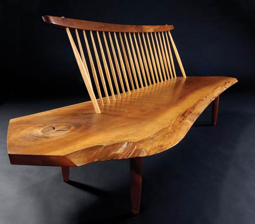 The price of sitting pretty on this walnut Conoid bench with back is $78,000. It sold at the Oct. 27 sale at Sollo Rago. Image courtesy Sollo Rago Auctions.