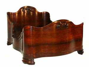 The top lot of the sale was this beautiful laminated rosewood bed, made around 1850 by John Henry Belter ($33,350).