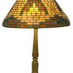 Signed Tiffany Studios American Indian basketweave-pattern lamp, 17 inches tall with 12-inch-diameter shade. Estimate: $15,000-$25,000.