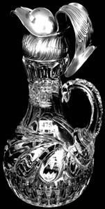 Glass-handled jug with sterling top, 14”, with elaborate sterling wing-shaped engraved spout and coat of arms ($8,000).