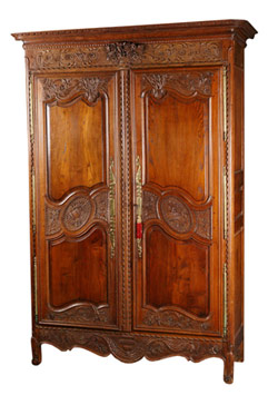 French provincial carved and paneled oak armoire, ex Elizabeth Parke Firestone Collection, estimate $4,000-$6,000.