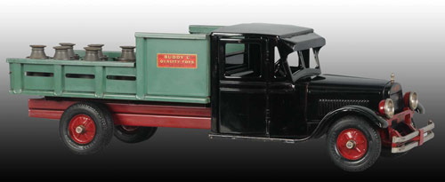 Circa 1930 Buddy ‘L’ Jr. pressed-steel dairy truck, 24 inches long with opening doors, nickel-plated bumper with headlights, accompanied by six original accessory milk cans - $11,500.