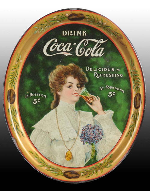 Early lithographed tin Coca-Cola tray featuring lady with ‘Gibson Girl’ appearance - $12,075.  