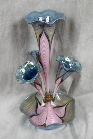 One of two made, an 18½-inch-tall artist’s proof of a pulled-feather luster epergne hand blown by master glass artist Richard Golding of Okra Studios, Stourbridge, England.