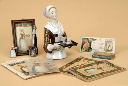 Circa-1900 German glazed porcelain half doll (or pincushion doll) of the famous La Belle Chocolatiere, symbol for Baker’s Chocolate. Stands 7 inches tall. Lot includes Baker’s Chocolate ephemera lot comprised, in part, of postcard, three recipe books, trade card, souvenir spoon and die-cast pencil sharpener. Estimate: $2,000-$3,000.  