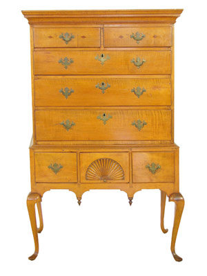 A Queen Anne figured maple fan carved flat-top highboy circa 1776 from Massachusetts. Image courtesy Gray's Auctioneers.
