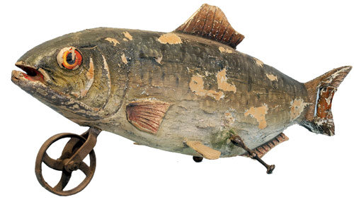 This highly unusual 5-foot figural fish was once used as a trade sign in front of a fishmonger’s shop. It has a front guiding wheel, cast-iron supports and a tail that functions as a handle. Image courtesy Bertoia Auctions.