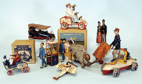 An extensive selection of tinplate wind-up Lehmann toys from the early 1900s includes a Naughty Boy with box (bottom left), Mandarin (to right of Naughty Boy), a boxed Lehmann Tut-Tut (top center) and a very desirable boxed Baker & Chimney Sweep (not shown). Image courtesy Bertoia Auctions. 