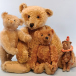 A large assortment of Steiff bears will be ready for their close-ups at Bertoia’s Nov. 7-9 auction, including a coveted and very rare “rod” bear (front and center) that was X-rayed to confirm that it contained the early Steiff rod mechanism. Image courtesy Bertoia Auctions.