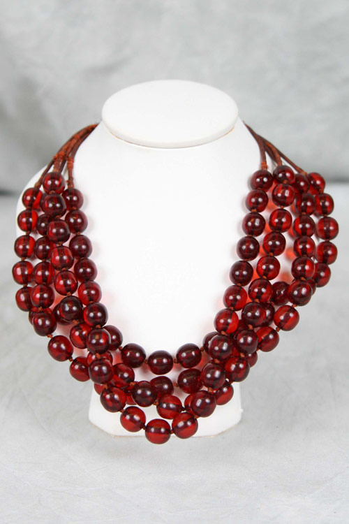 All original 4-strand cherry amber Bakelite necklace. Image courtesy Estate Roadshow.