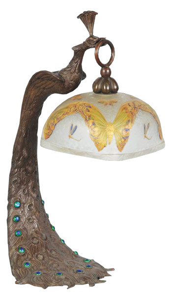 Rare bronze peacock lamp with inset iridescent jewels adorning the bird’s feathers, and with an enameled Mont Joye shade. Image courtesy Morphy Auctions.