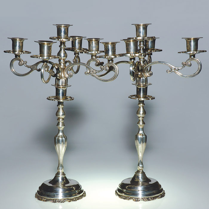 Mexican silversmiths produced tableware for all aesthetic tastes. This pair of sterling silver candelabra in traditional style (height 20 inches, weight 184 troy ounces). Courtesy Cincinnati Art Galleries.