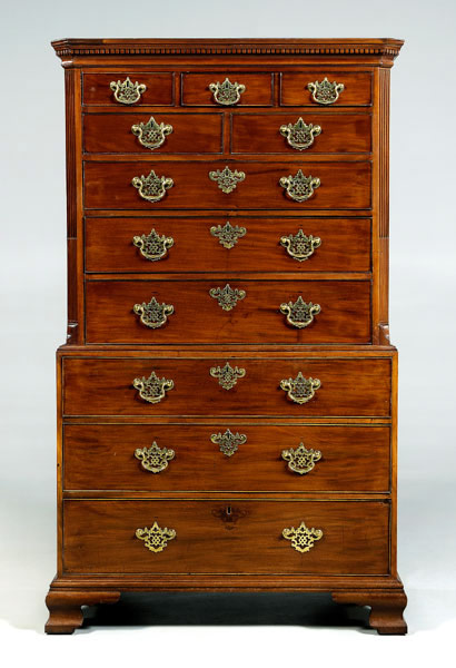 Note the heavy Chinese Chippendale brasses on this 72½ inch by 44½ inch by 24¼ inch Charleston Chippendale chest on chest in figured mahogany veneers. The feet and bed molding have been replaced and it has been refinished. Presale estimate is $50,000-$80,000 with a $40,000 reserve. Image courtesy Brunk Auctions.