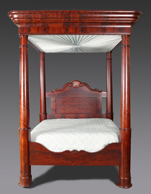 Circa-1860s New Orleans mahogany four-poster canopy bed with beveled, flame-mahogany-wrapped posts. Estimate: $8,000-$12,000. Image courtesy Quinn's Auction Galleries.