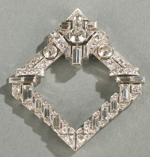 Art Deco brooch of exquisite quality, with a total weight exceeding 11 carats, given to the late Johanna Mikes in 1936 by King Zog of Albania (1895-1961). Quite possibly created by Osterreicher, the Viennese firm that designed for Ostier, official jewelers to the Albanian royal court. Estimate: $15,000-$25,000. Image courtesy Quinn's Auction Galleries.