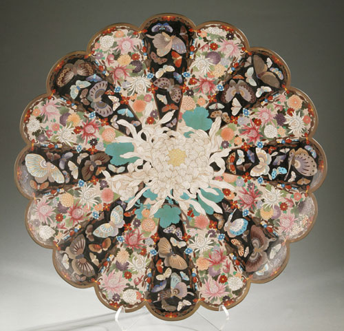 19th-century Chinese cloisonné charger with chrysanthemum and butterfly design. Sixteen radiating, alternating panels, scalloped edge. 23¾ inches in diameter, 3½ inches deep. Estimate: $1,000-$1,500. Image courtesy Quinn's Auction Galleries.