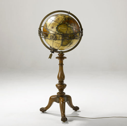 A turned walnut stand holds a Terra Lux illuminated globe made in 1934. Photo courtesy Rago's.