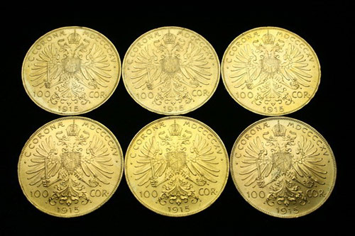 Group of six Austrian 1915 gold 100 Corona coins. Image courtesy Thomaston Place.