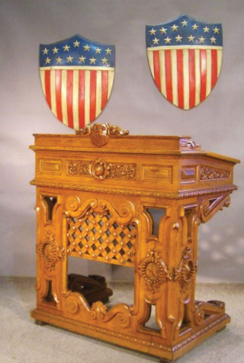 Thomas U. Walter, an architect of the U.S. Capitol, designed this 1857 oak desk for the House of Representatives. The painted tin shields also date to the 19th century. Image courtesy Stella Shows.