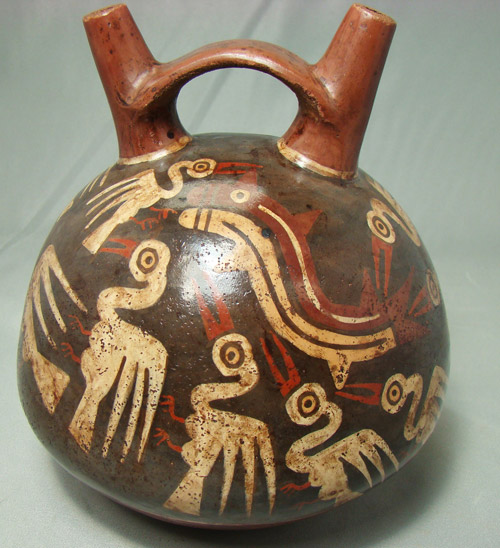 Pelicans and fish are depicted in the polychrome decoration on this circa third century bottle from Peru. Image courtesy of Malter Galleries Inc.