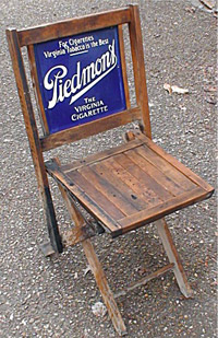 Unique advertising chair promoting Piedmont (Virginia) cigarettes, with porcelain sign embedded. Image courtesy Tom's Auctions & Appraisals.