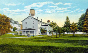 Canterbury Shaker Village as depicted on a 1920 postcard, courtesy Wikipedia.
