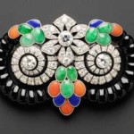 Art Deco diamond, onyx, jadeite and coral brooch by Boucheron Paris, sold for $189,600. Image courtesy Skinner Inc.