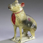 Cowan's Auctions sold this  Pennsylvania chalkware dog bank for $2,301 two years ago. The 9 1/4-inch-tall figure has original polychome paint. Image courtesy Cowan's Auctions and LiveAuctioneers.com Archive.