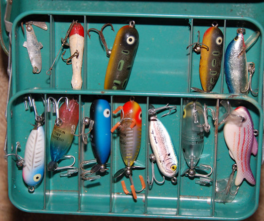Imagine opening a vintage tackle box and discovering a range of antique lures. Image courtesy Dudley Auction.