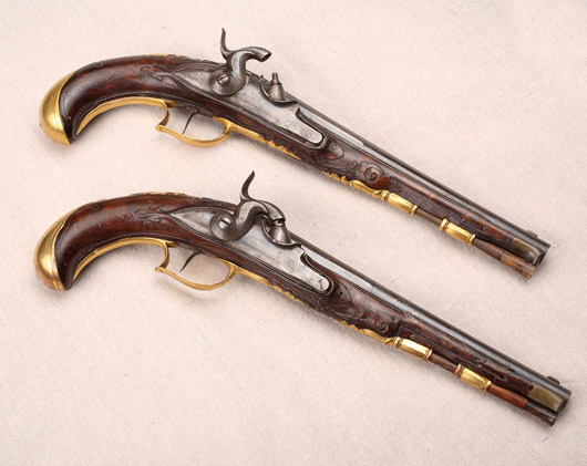 Pistols - A pair of German Kuchex Ruter pistols, 1716-1758, $4,817. Image courtesy Aberdeen Auction Galleries.
