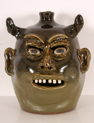Late 1970s/early 1980s Devil Jack O'Lantern by renowned Georgia potter Lanier Meaders ($6,325). Image courtesy Slotin Auction.
