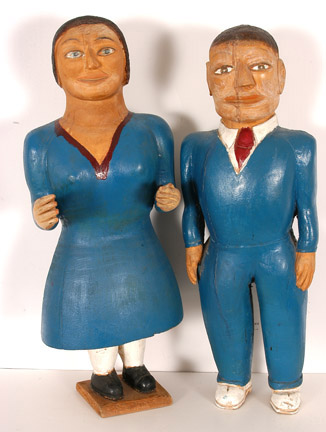 Pair of carved and painted wooden figures by S.L. Jones, titled Couple in Blue ($12,650). Image courtesy Slotin Auction.