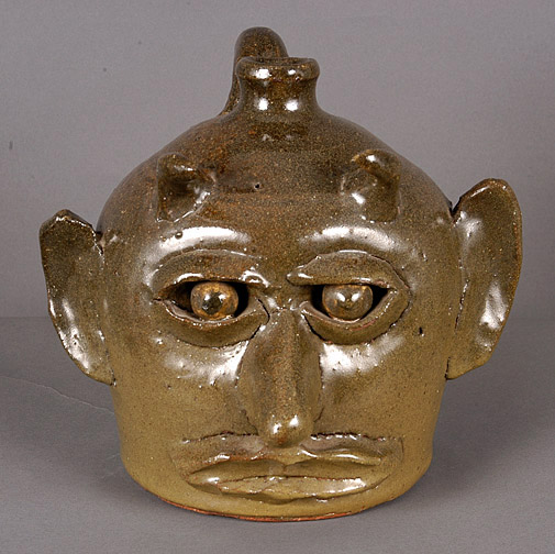 From the collection of the Smithsonian, this rare devil face jug by Lanier Meaders raised $18,000 inclusive of the buyer's premium in May 2007. Image courtesy Slotin Folk Art.