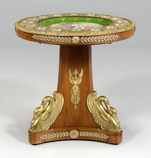 A large hand-painted porcelain plaque depicting Napoleon's coronation forms the center of the tabletop on this Napoleon III style Sevres table, which has an estimate of $8,000-$12,000. Image courtesy Brunk Auctions.