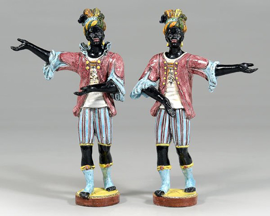 An arm has been repaired on this pair of Continental majolica blackamoors, said to have been owned by a U.S. ambassador to Great Britain. Image courtesy Brunk Auctions.