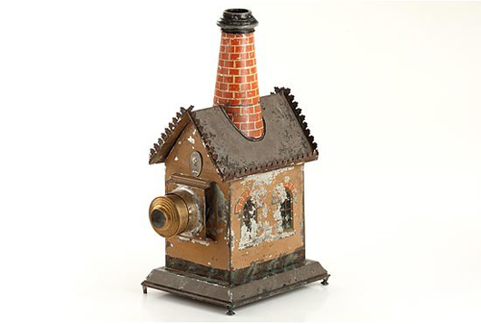 Shaped like a factory, this toy magic lantern will be in Westlicht's auction May 20-23. Image courtesy Westlicht.