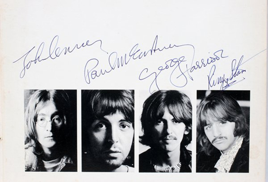 WJohn, Paul, George and Ringo all autographed the inside cover of the Beatles' ‘White Album' above their pictures. Image courtesy DuMouchelles.
