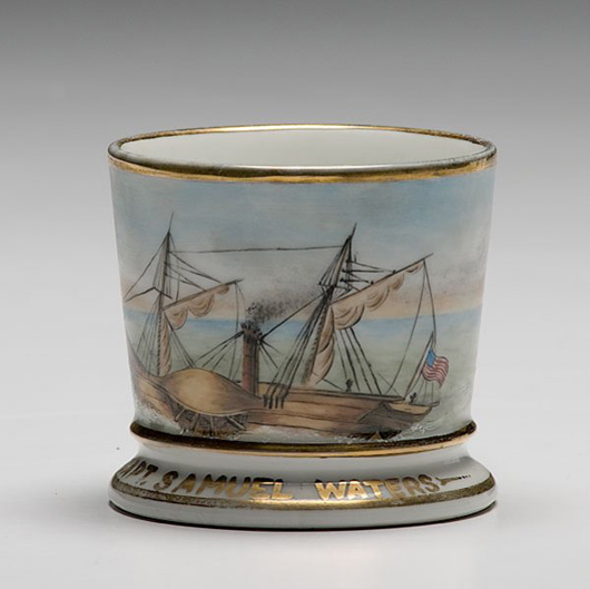 The captain of a ship once owned this shaving mug, which pictures an ocean-going side-wheel sail steamboat. It carries an $800-$1,000 estimate. Image courtesy Cowan's Auctions.