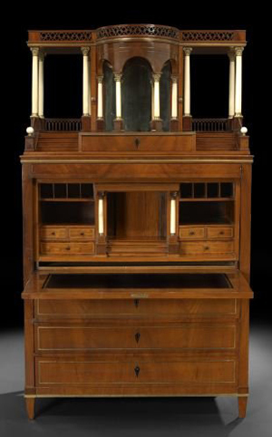 Dating to the first quarter of the 19th century, this North German Neoclassical mahogany secretary stands 79 inches high.