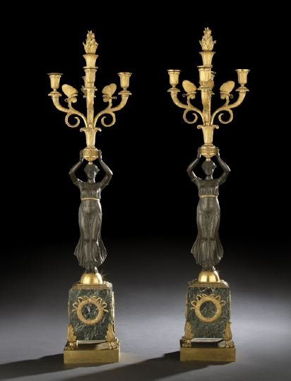 Standing triumphantly is an imposing pair of French bronze and marble candelabra featuring the Greek goddess Nike. These early 19th-century pieces have a $12,000-$18,000 estimate.