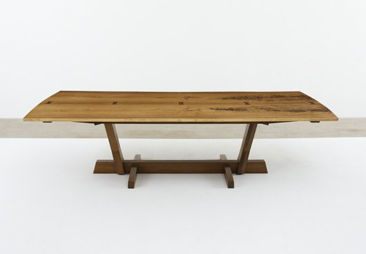 George Nakashima monumental "Conoid" dining table, 1989. Estimate $150,000-$200,000. Image courtesy LiveAuctioneers.com and Phillips de Pury & Co.