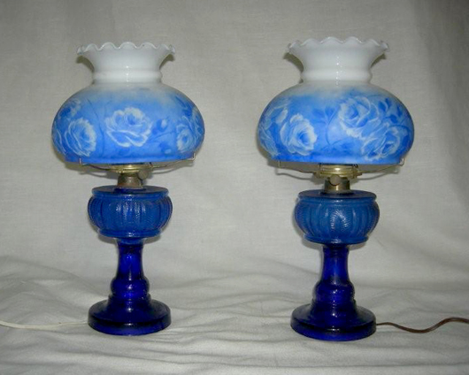 Pair of electrified blue kerosene lamps.