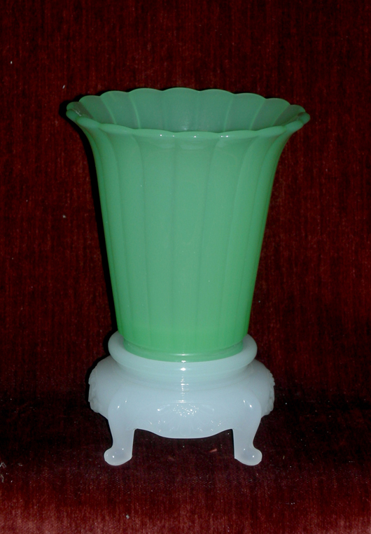 Fine green opaque vase on an Oriental-style stand.