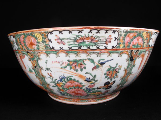 This Chinese Rose Medallion bowl is 19 1/2 inches in diameter and rests on a carved wooden stand. It has a $1,200-$1,500 estimate. Image courtesy Neapolitan Auctions.
