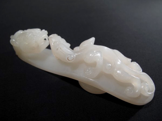 Bidding should surpass the $600-$800 estimate for this 19th-century carved white jade belt buckle. Image courtesy Neapolitan Auctions.