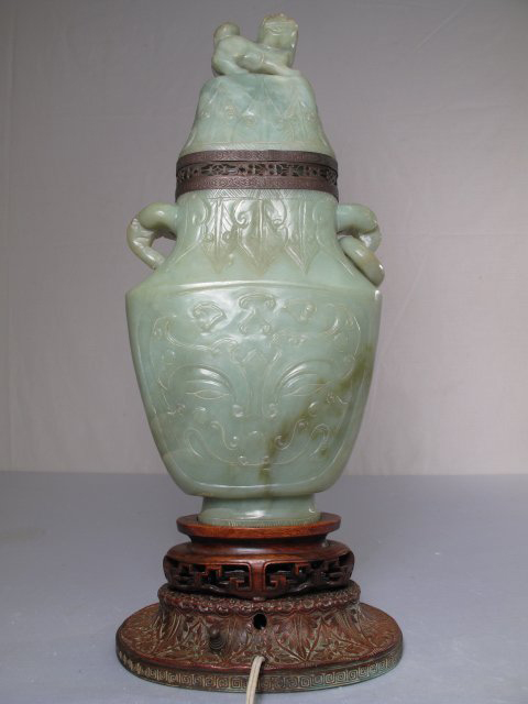With its foo dog finial the Chinese urn-form table lamp of light green jade stands 21 inches high. Image courtesy Neapolitan Auctions.